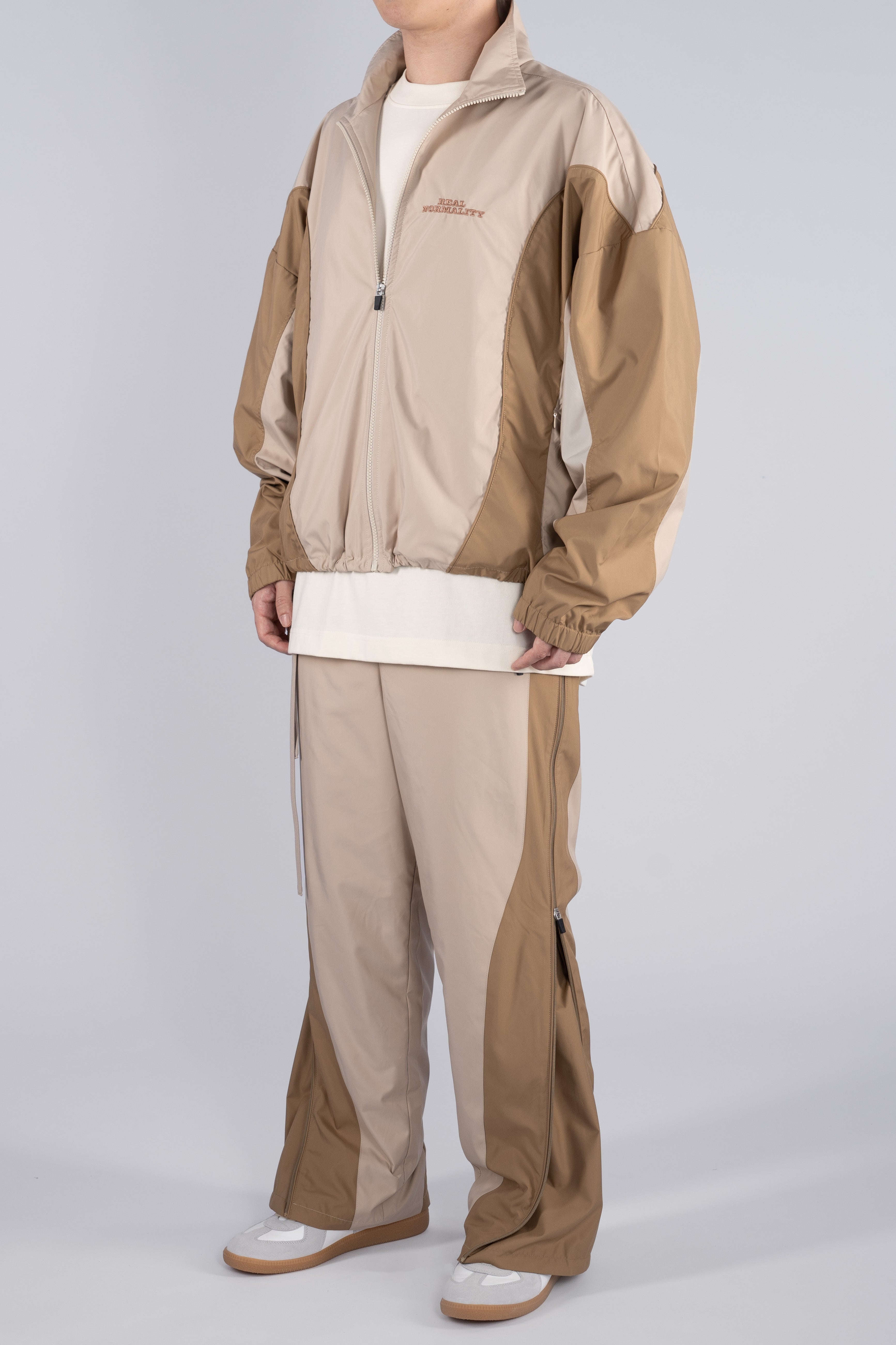 “REAL NORMALITY” Panelled Track Jacket - Beige/Khaki