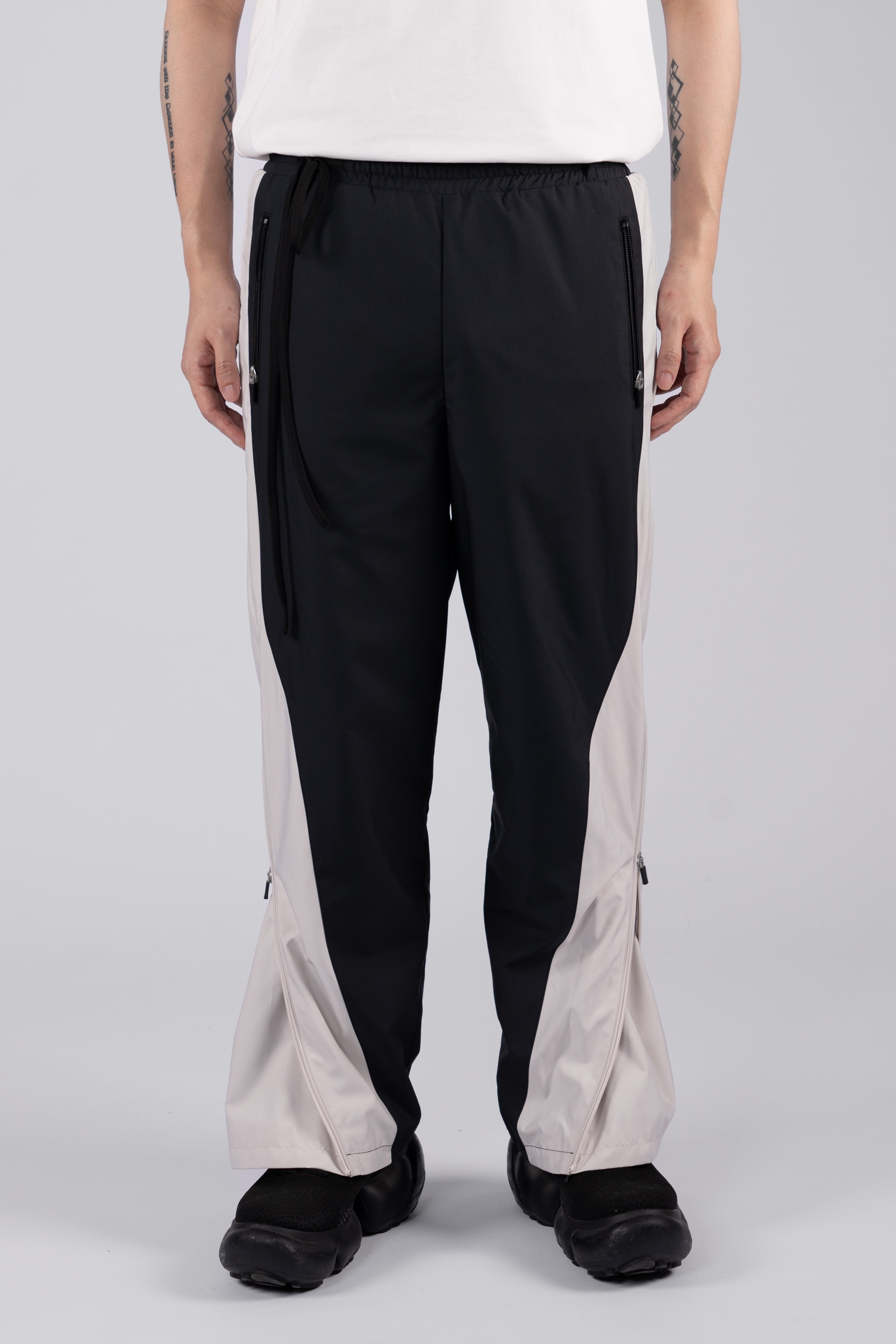 “REAL NORMALITY” Panelled Track Pants - Black/Off White