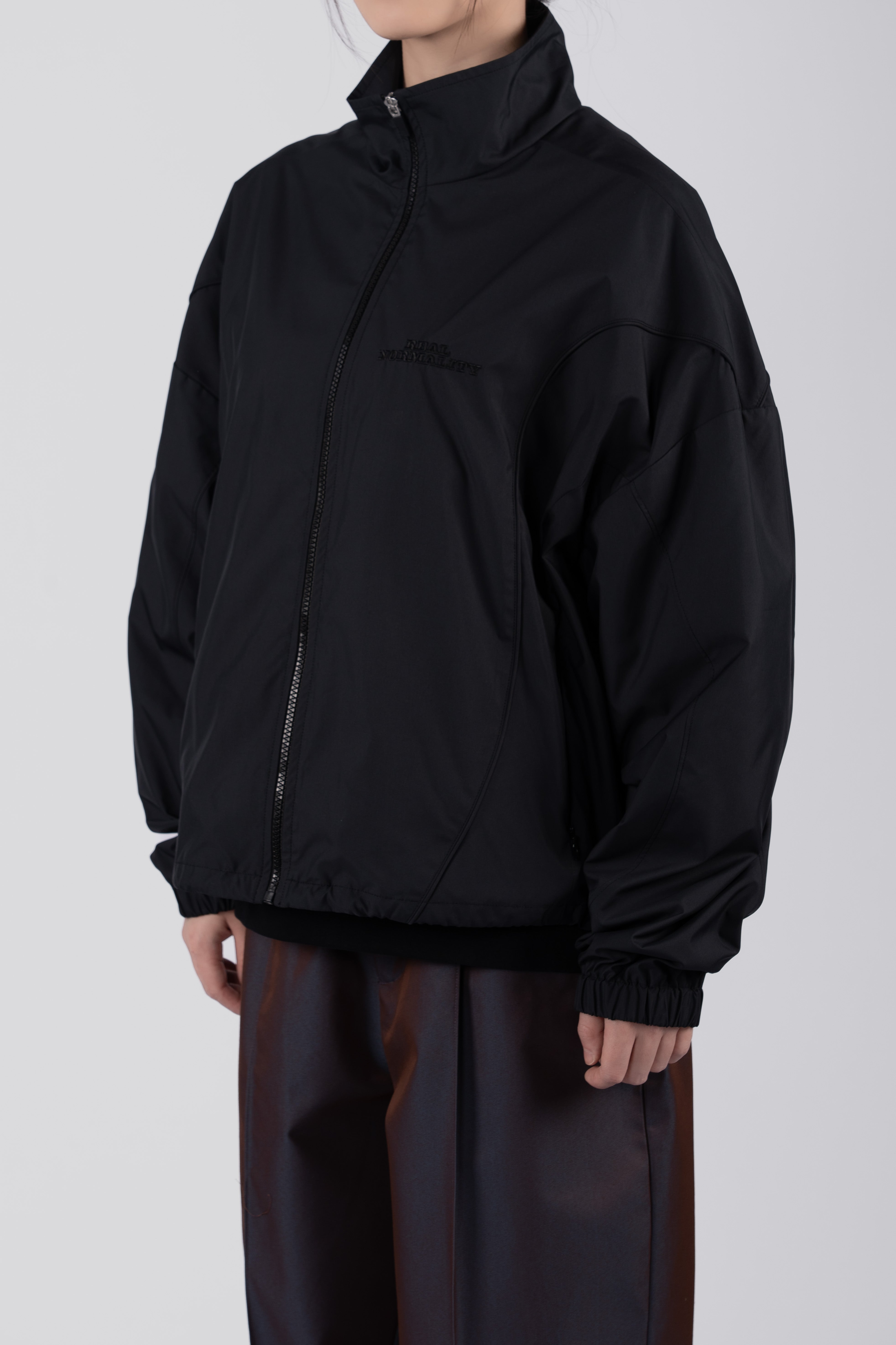 “REAL NORMALITY” Panelled Track Jacket - Black/Black