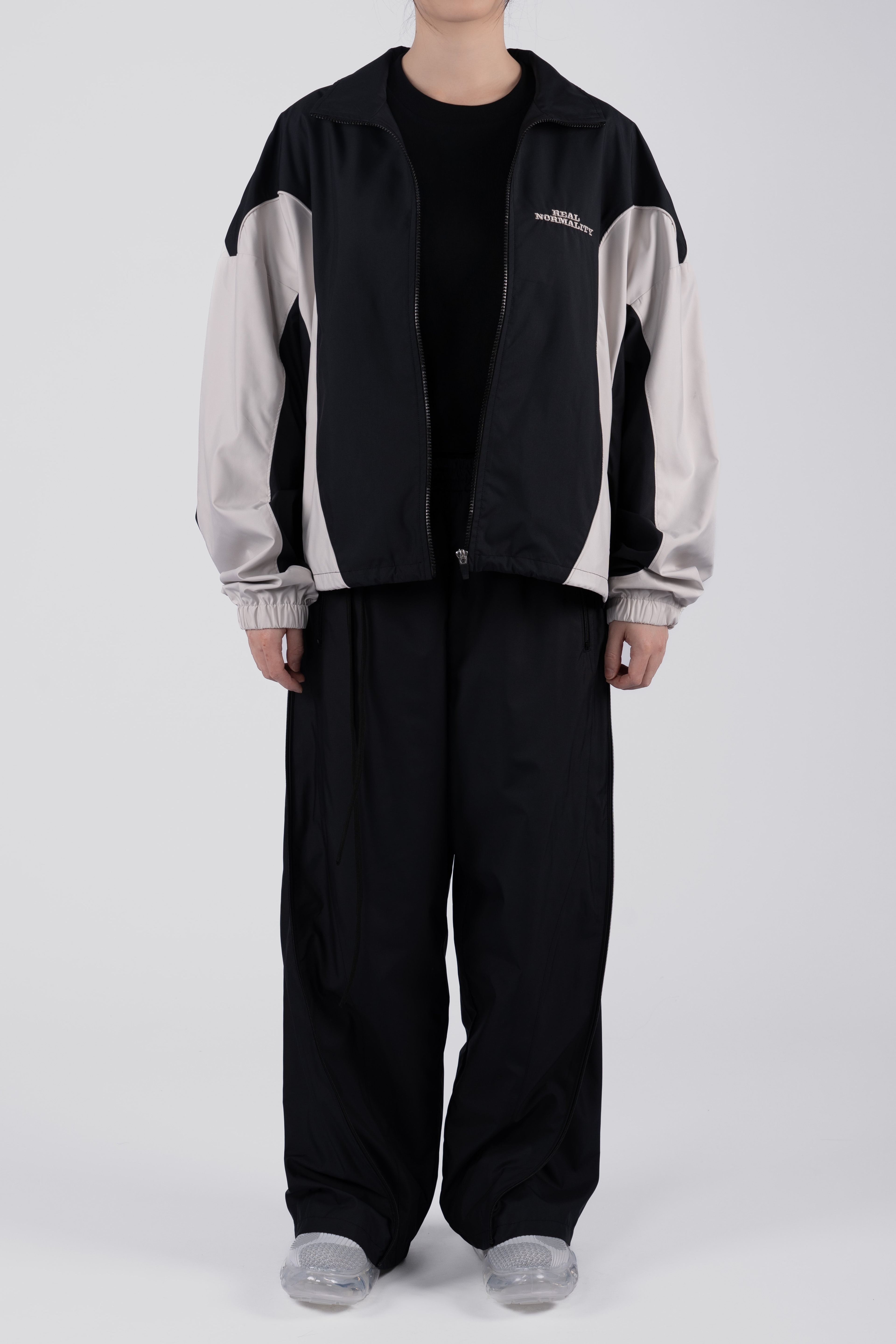 “REAL NORMALITY” Panelled Track Jacket - Black/Off White